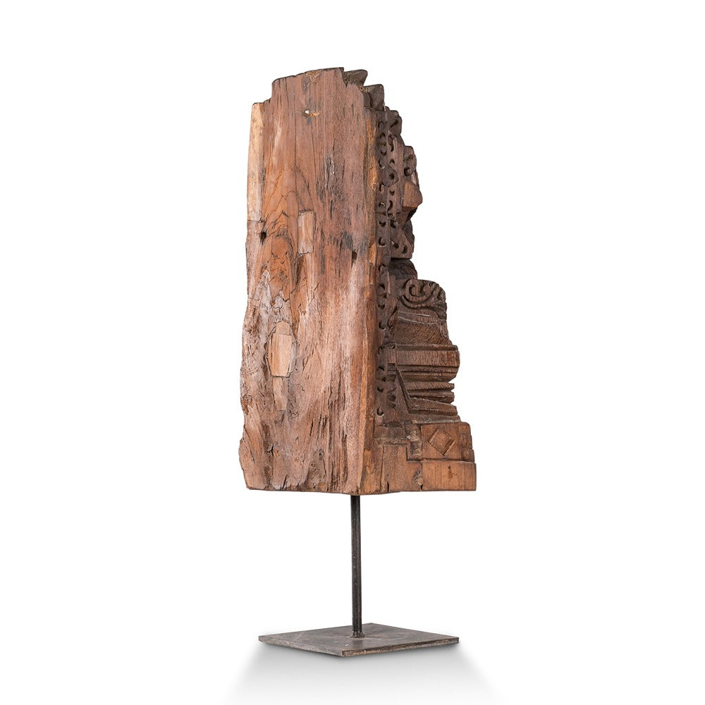 wooden sculpture on stand